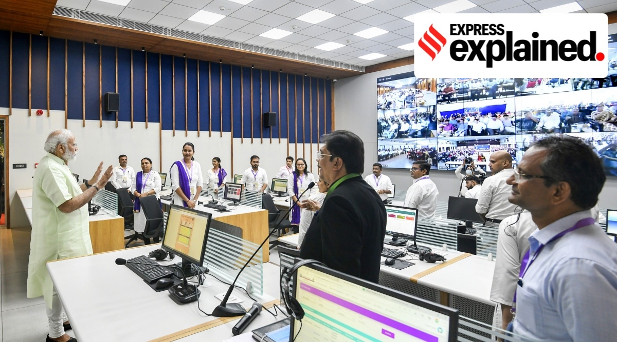 Prime Minister Narendra Modi interacts with the staff during his visit to Vidya Samiksha Kendra, in Gandhinagar. (PTI Photo)