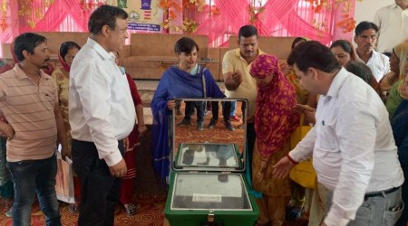 Samba deputy commissioner Anuradha Gupta distributed solar chulhas among women.(Express photo)