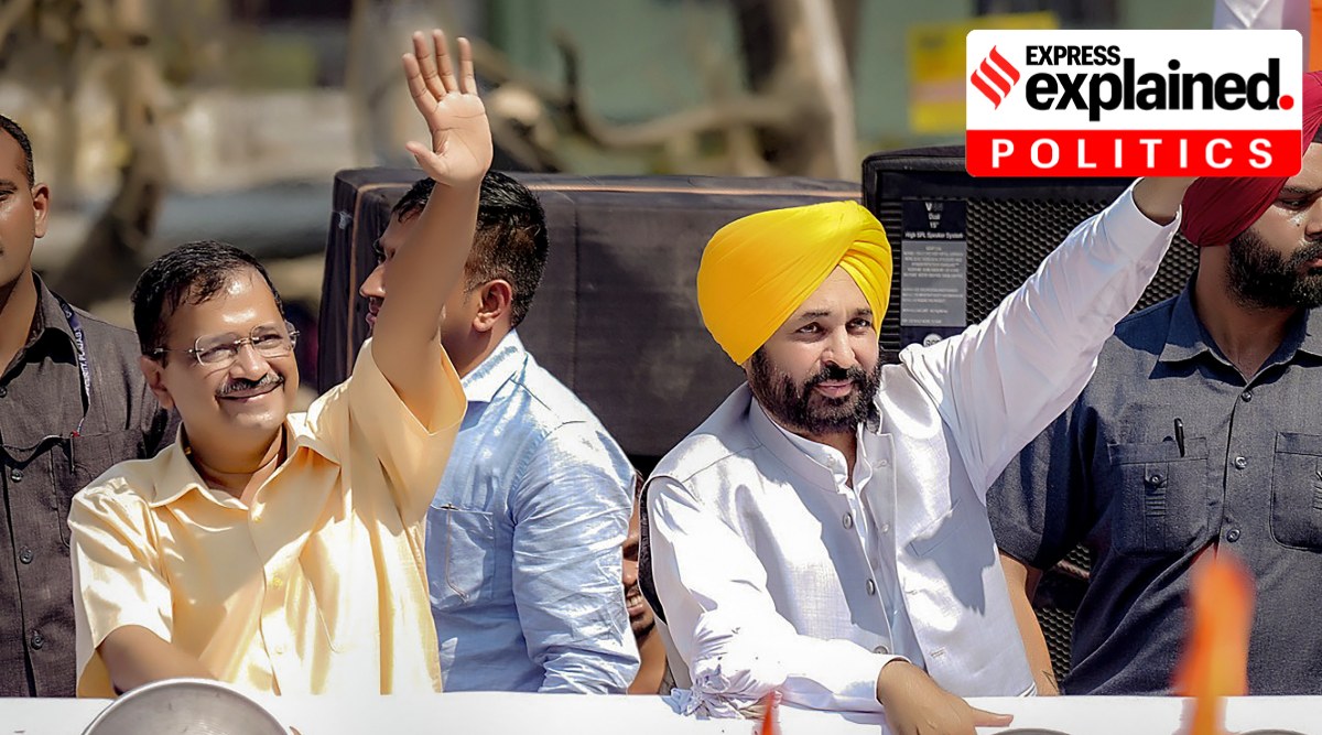 Punjab Chief Minister Bhagwant Mann and Delhi Chief Minister Arvind Kejriwal wave at supporters during a roadshow in Mandi. (PTI Photo/File)