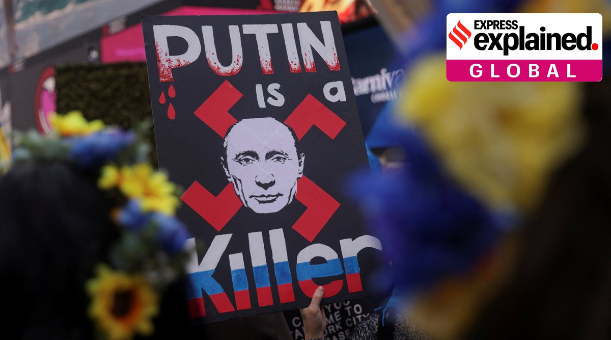 A person holds a placard during a 'Stop Genocide of Ukraine People' rally and protest against Russia's invasion of Ukraine, in Times Square in New York City, U.S., April 9, 2022. (Reuters Photo: Jeenah Moon)