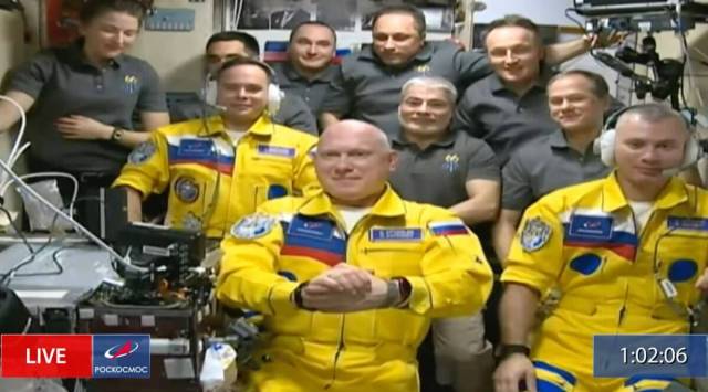 Russian cosmonauts Sergey Korsakov, Oleg Artemyev and Denis Matveyev are seen during a welcome ceremony after arriving at the International Space Station, Friday, March 18, 2022. (Image credit: Roscosmos via AP)