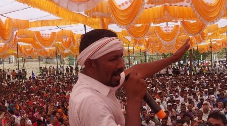 Congress leader Yusuf Gamit addresses a gathering at songadh town in Tapi district. (Express Photo)