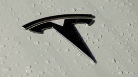 Tesla customers in India are left waiting six years after paying 1000 dollars to pre book the Model 3. Image shows a close up of the Tesla logo on a car.
