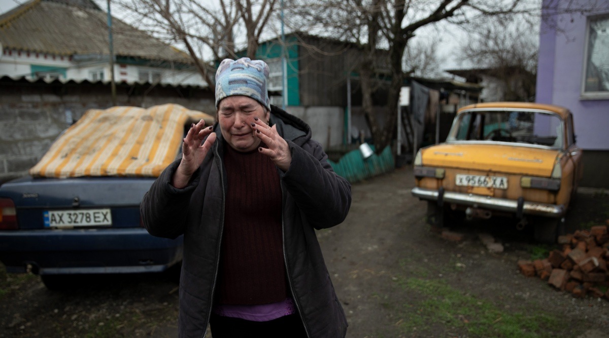 Lubov Dvoretska, a biology teacher whose husband was killed in a bombing, in the village of Husarivka, Ukraine, April 14, 2022. Russian forces no longer occupy the village, but relatives and neighbors wonder what happened to five men who went off to feed their cattle. (Tyler Hicks/The New York Times)