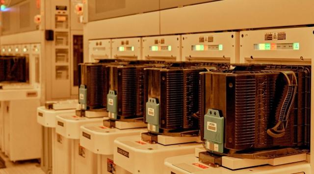 The specialized machines that receive pods full of silicon wafers in the making of microchips, at Intel’s complex in Chandler.(Philip Cheung/The New York Times)