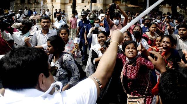 SUCI activists Tuesday protest in front of Raj Bhawan in Kolkata over the Nadia gangrape and murder. (Express Photo)