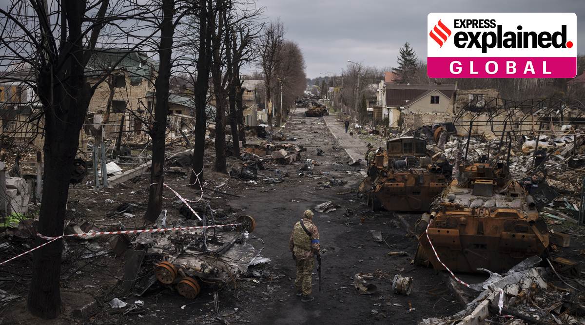 A Ukrainian serviceman walks amid destroyed Russian tanks in Bucha, on the outskirts of Kyiv, Ukraine, April 6, 2022. (AP Photo)