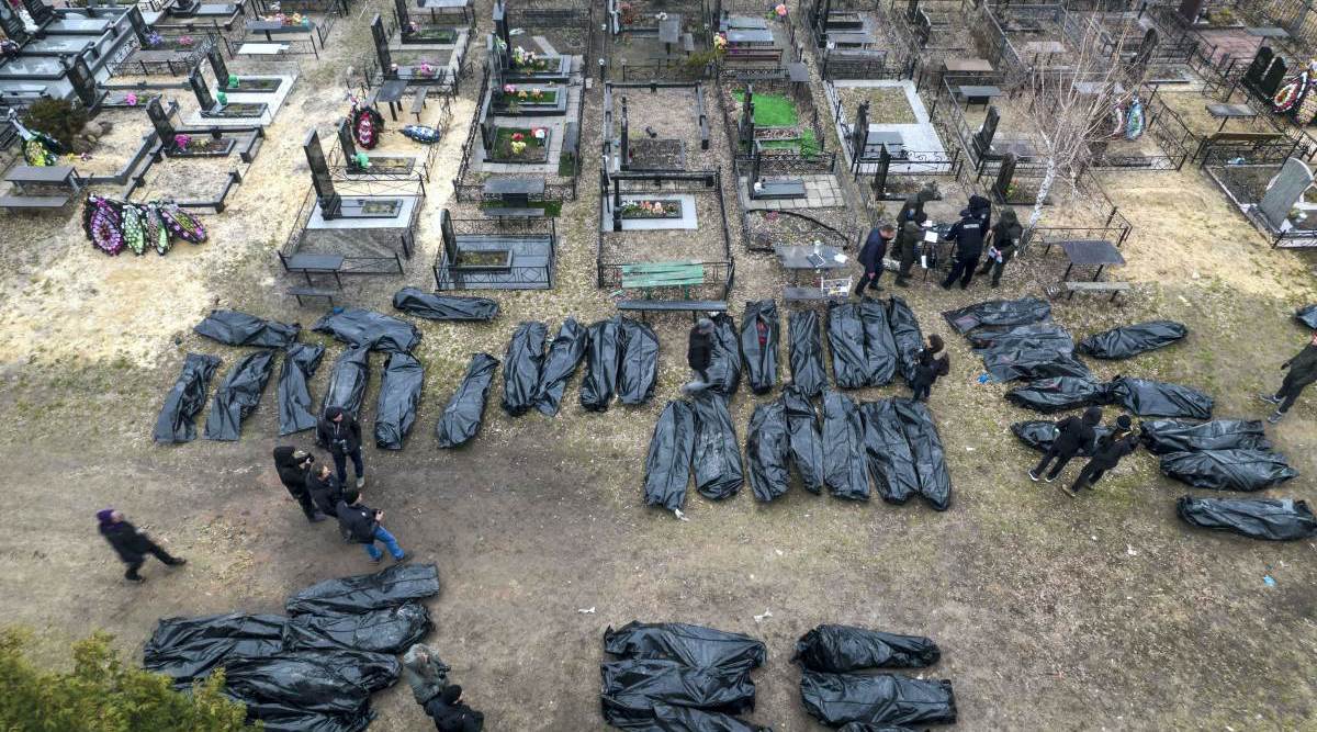 Kyiv: Policemen work on the identification process following the killing of civilians in Bucha, before sending the bodies to the morgue, on the outskirts of Kyiv, Ukraine, Wednesday, April 6, 2022. (Photo: AP/PTI)