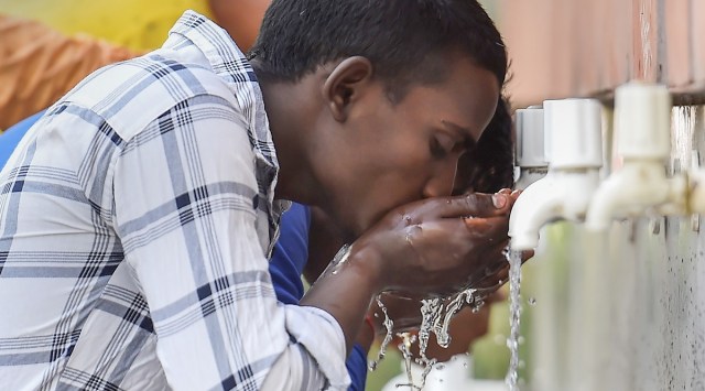 Tourists drink water from taps at Rajghat, on a hot summer day in New Delhi. (PTI)