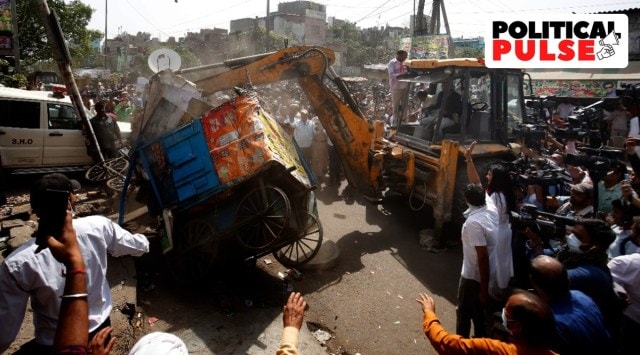 Several street carts and parts of shops were demolished in the exercise. (Express photo by Praveen Khanna)