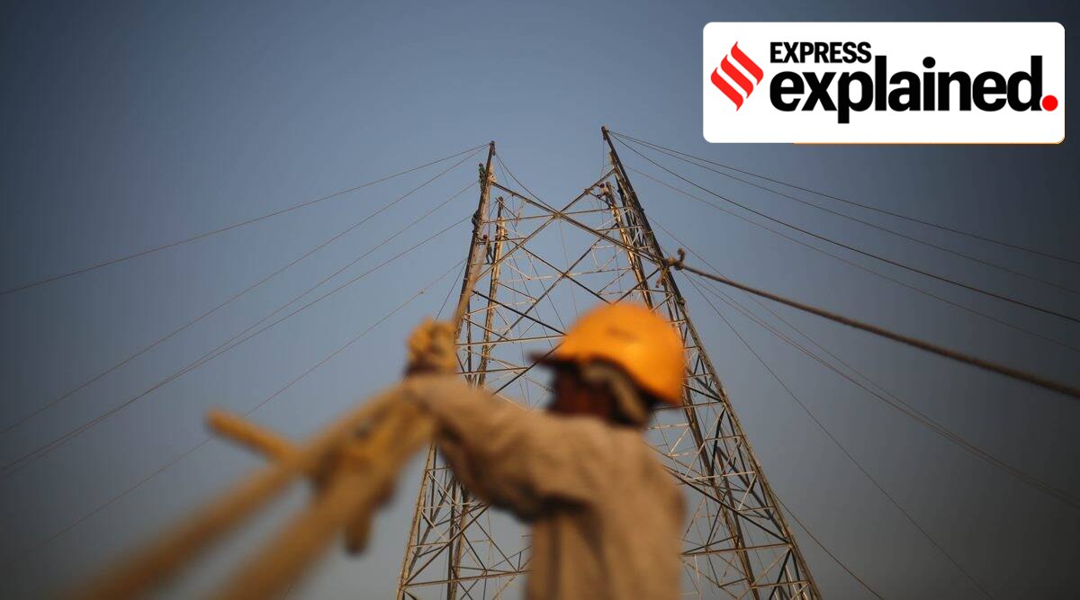 Workers put up wires at a construction site. (Express Photo: Tashi Tobgyal, Representational)