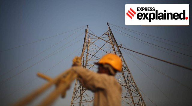 Workers put up wires at a construction site. (Express Photo: Tashi Tobgyal, Representational)
