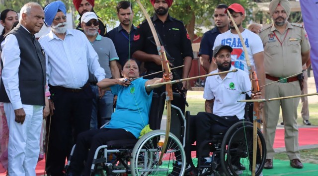 Governor Punjab and UT Administrator Banwarilal Purohit with players after inaugurates the Sports Carnival for persons on Wheelchairs at Sukhna Lake sports complex in Chandigarh on Saturday. Express Photo by Kamleshwar Singh