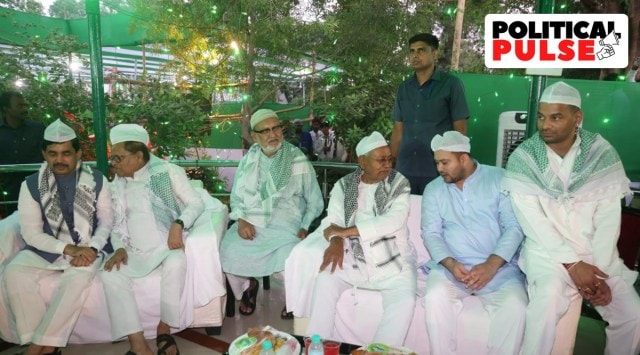 Bihar Chief Minister Nitish Kumar with Tejashwi Yadav and Tej Pratap Yadav at RJD’s iftar party. (Photo: Twitter/@yadavtejashwi)