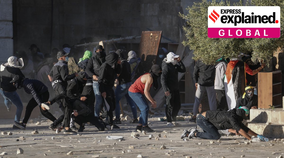 Palestinians clash with Israeli security forces at the Al Aqsa Mosque compound in Jerusalem's Old City Friday, April 15, 2022. (AP Photo/Mahmoud Illean)