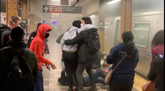 This photo provided by Will B Wylde,  a person is aided outside a subway car in the Brooklyn borough of New York, April 12, 2022.(AP/PTI)