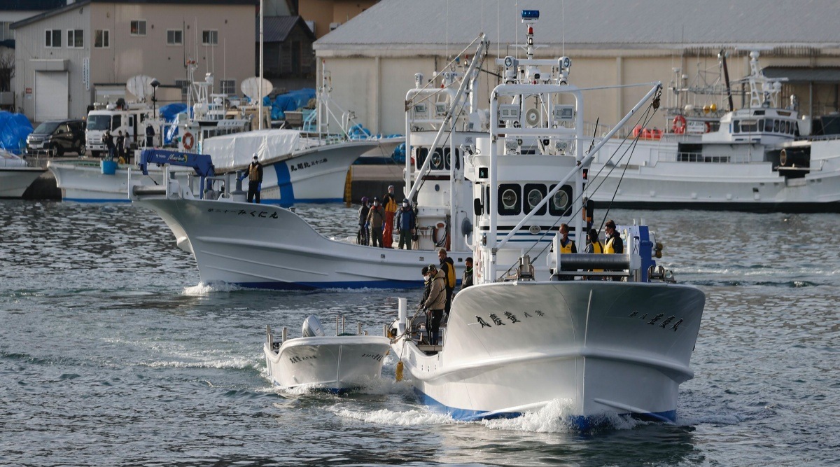 Fishing boats leave a port to search for a missing tour boat in Shari, in the northern island of Hokkaido Sunday, April 24, 2022. The Japanese Coast Guard said Sunday that their helicopters found four of the 26 people on a tour boat missing since the day before. (Kyodo News via AP)