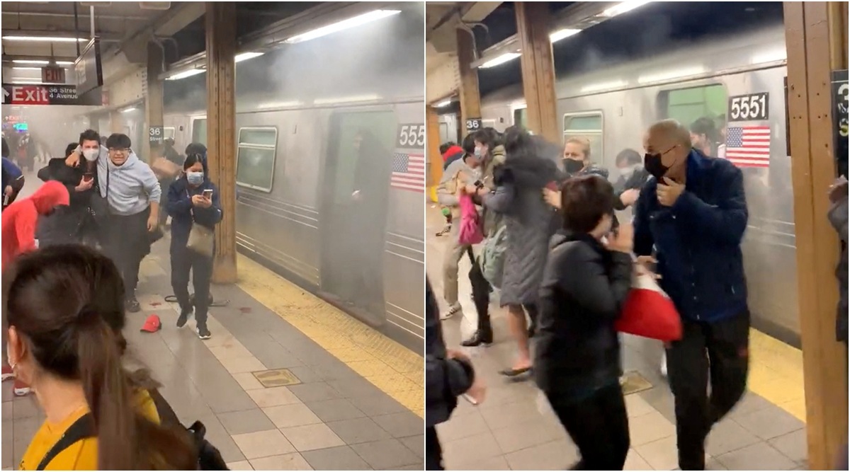A person helps an injured man after a shooting at a Brooklyn subway station, in New York City as people run away after a shooting at a Brooklyn subway station, in New York City, New York, US, April 12, 2022 in this screen grab obtained from a social media video. (Will B. Wylde/via Reuters) 