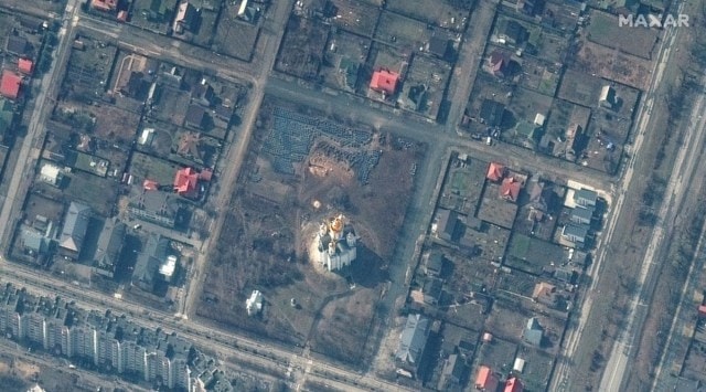 A satellite image shows the grave site with an approximately 45-foot (approximately 13,7 meters) long trench in the southwestern section of the area near the Church of St. Andrew and Pyervozvannoho All Saints, in Bucha, Ukraine, March 31, 2022. Picture taken March 31, 2022.