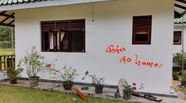 Graffiti written by anti-government faction is pictured at a house belonging to the former Prime Minister Mahinda Rajapaksa's family in Weeraketiya, Sri Lanka, May 11, 2022. (Reuters)