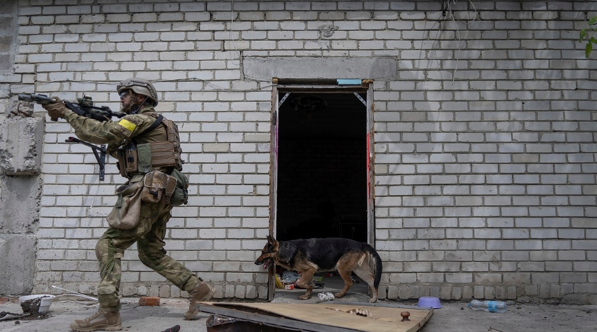 A Ukrainian serviceman patrols during a reconnaissance mission in a recently retaken village on the outskirts of Kharkiv, east Ukraine. (AP)