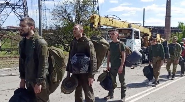 In this photo taken from video released by the Russian Defense Ministry on Friday, May 20, 2022, Ukrainian servicemen are pictured as they leave the besieged Azovstal steel plant in Mariupol, in territory under the government of the Donetsk People's Republic, eastern Ukraine. (AP)