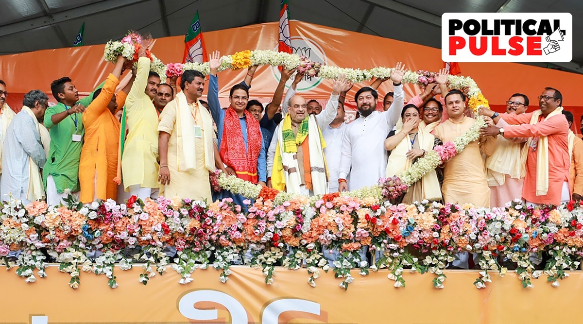 Union Home Minister Amit Shah being garlanded during a public rally, in Siliguri. (PTI Photo)