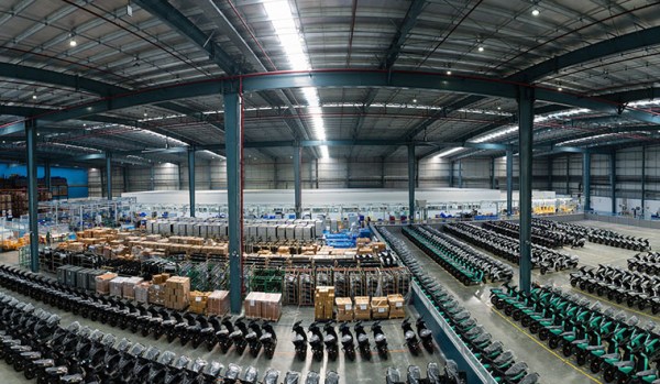 Wide angle photo of Ather scooters parked at their factory in Hosur