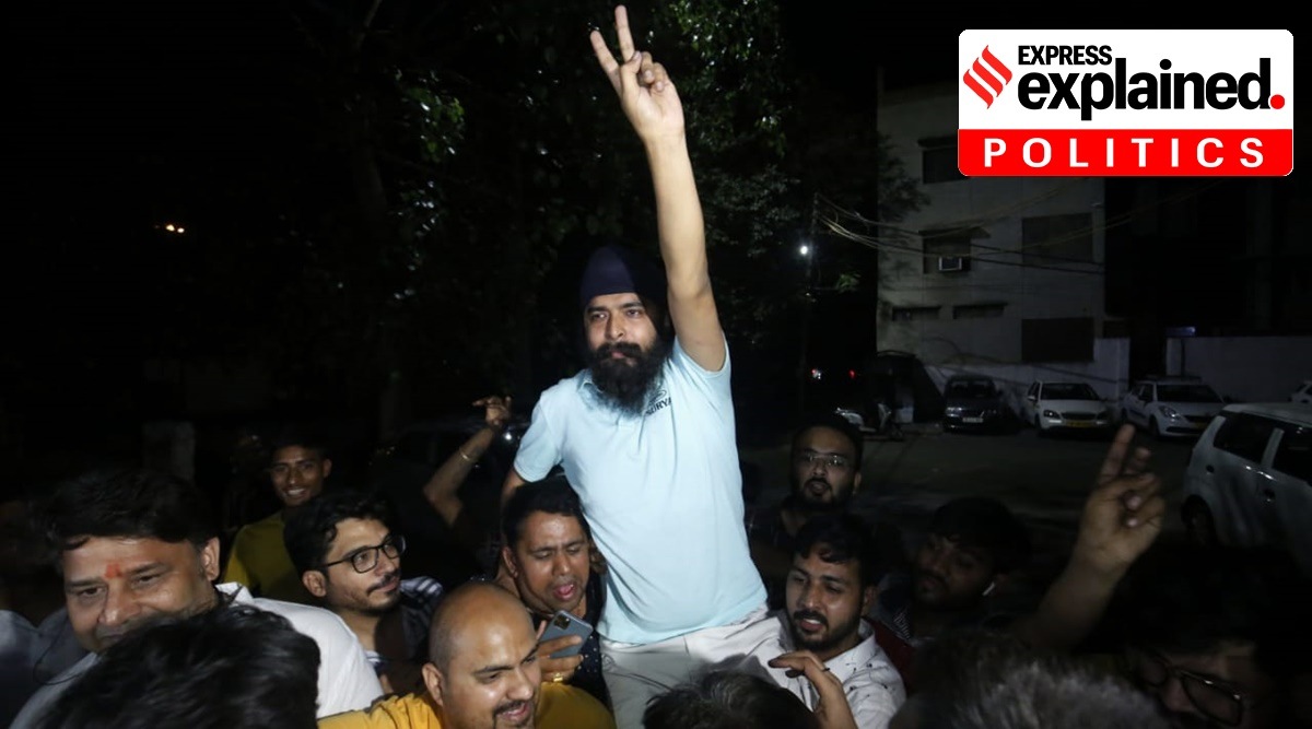 BJP spokesperson Tajinder Pal Singh Bagga flashes the victory sign after returning home, in New Delhi on Friday. (Express Photo: Praveen Khanna)