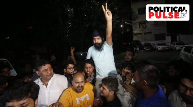 BJP spokesperson Tajinder Pal Singh Bagga flashes the victory sign after returning home in New Delhi. (Express Photo: Praveen Khanna)