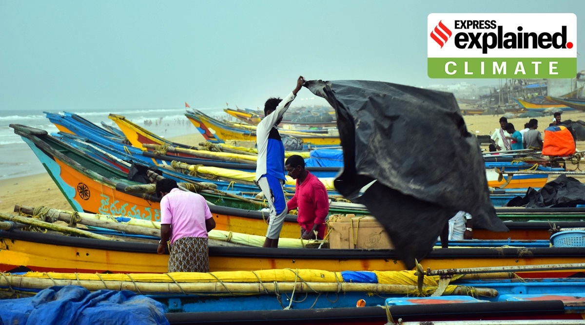 Fishermen cover their boats in the wake of Cyclone Asani, in Puri on Monday. (Photo: PTI)