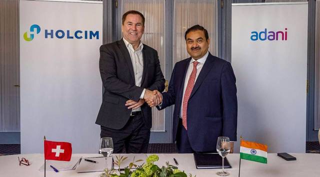 Gautam Adani with Holcim CEO Jan Jenisch in Ahmedabad, Sunday. (PTI)
