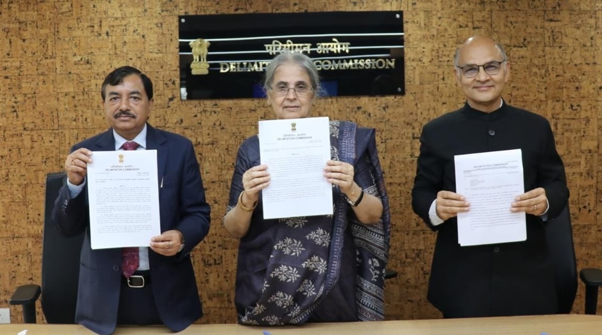 Members of the commission display the final delimitation order for the Union Territory, Thursday.