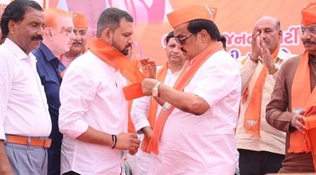 Gujarat BJP president C R Paatil welcomes former Congress MLA Anil Joshiyara’s son Keval to the party, in Bhiloda of Aravalli district Tuesday. (Twitter @CRPaatil)