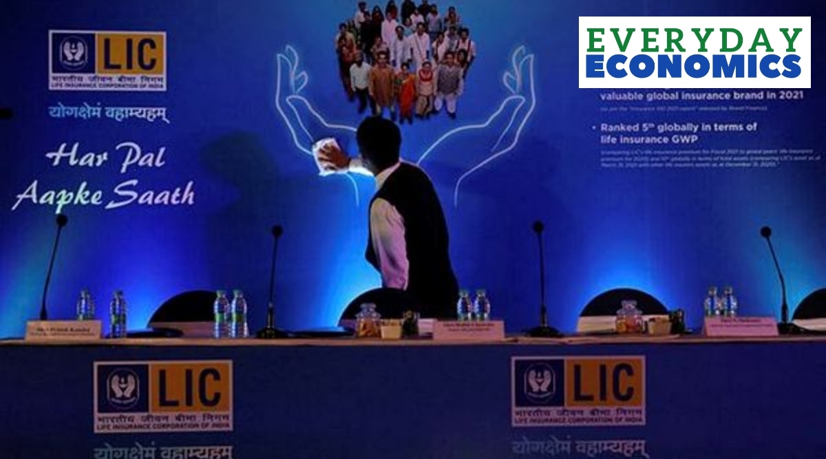 A man cleans a hoarding of Life Insurance Corporation of India (LIC) before the start of a news conference about the LIC initial public offering (IPO) launch, in Kolkata, India, April 29, 2022.  (Reuters)