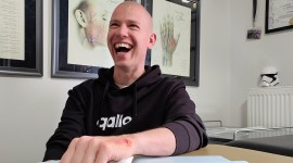 A man laughing after getting a walletmor payment implant