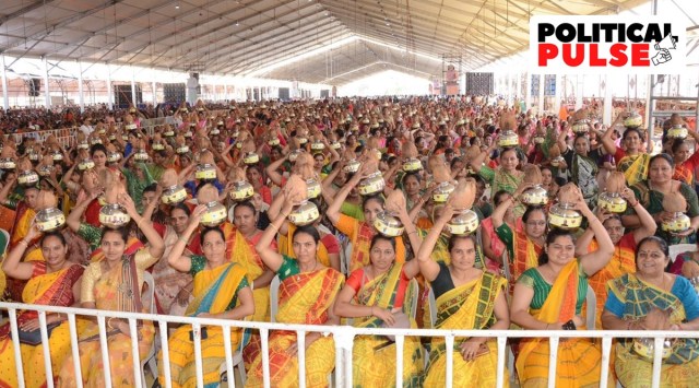 Women clad in saffron sarees at the public meeting addressed by PM Narendra Modi, in Atkot village, in Rajkot on Saturday. (Express photo)
