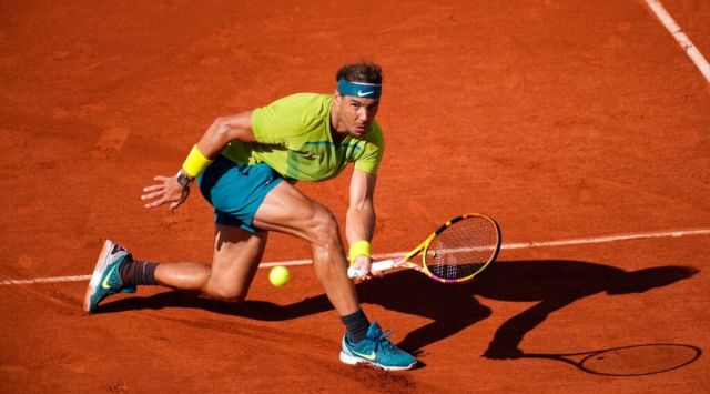 Spain's Rafael Nadal returns the ball to Netherlands' Botic van de Zandschulp during their third round match of the French Open tennis tournament at the Roland Garros stadium Friday, May 27, 2022 in Paris. (AP Photo/Christophe Ena)