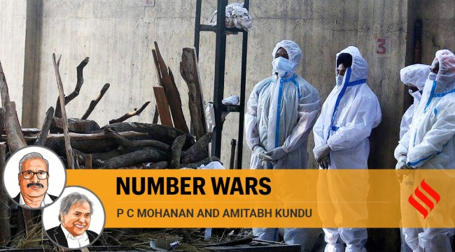 A family performs the last rites of a Covid-19 victim in Ludhiana. (Express Photo: Gurmeet Singh, File)