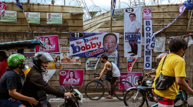 Campaign posters in Manila. Filipinos headed to the polls on Monday in a hotly contested election that has been described as the most consequential in decades, one that will shape the direction of the country's fragile democracy. (Jes Aznar/The New York Times)