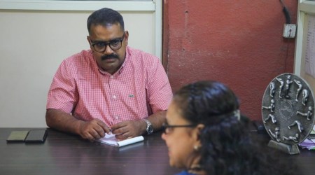 Roney George with the 52-year-old woman who trained hard to be a pilot as a youngster. She was diagnosed with schizophrenia much later and now works with the Chaitanya Institute of Mental Health. (Express Photo/Ashish Kale)