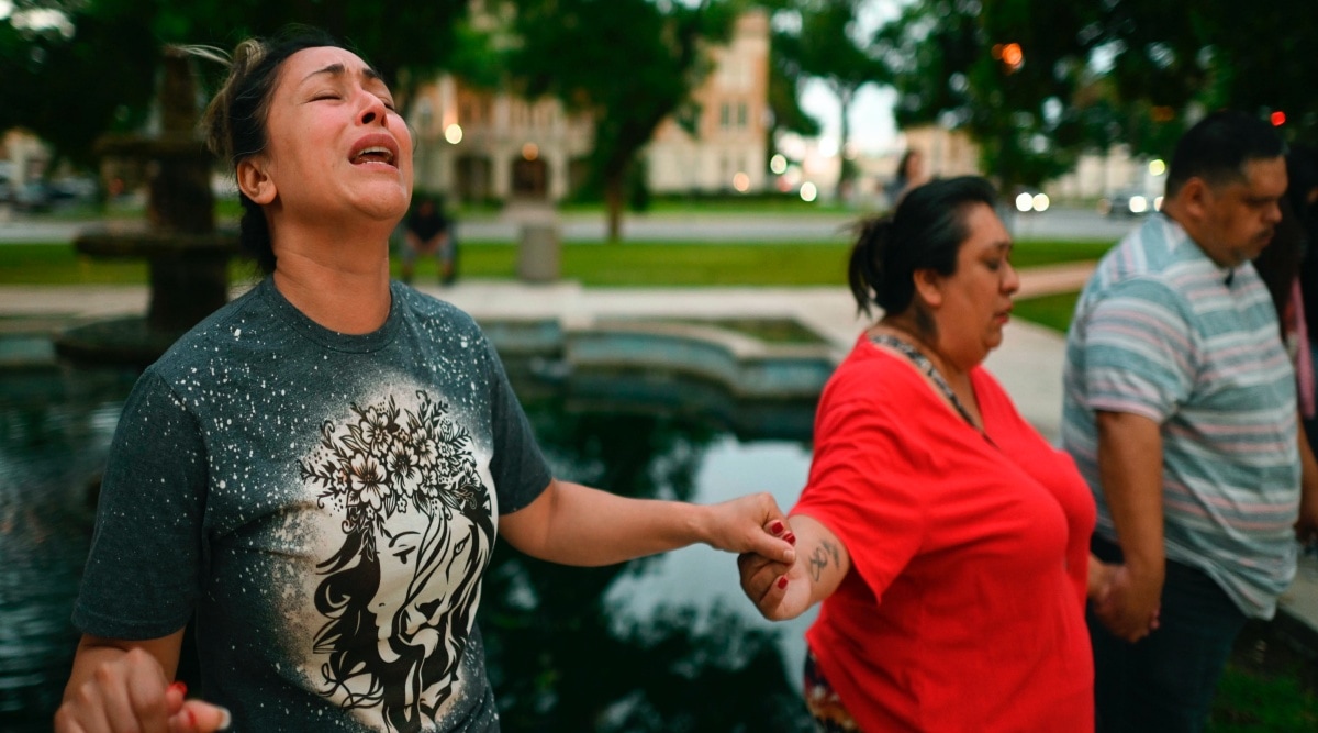 Kladys Castellón prays during a vigil for the 18 children and three adults that died at a mass shooting at Robb Elementary School in Uvalde on Tuesday, May 24, 2022. (AP)
