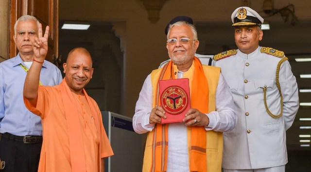 Uttar Pradesh Chief Minister Yogi Adityanath with state Finance Minister Suresh Kumar Khanna before the presentation of the State Budget 2022-23 in the Assembly, in Lucknow. (PTI)