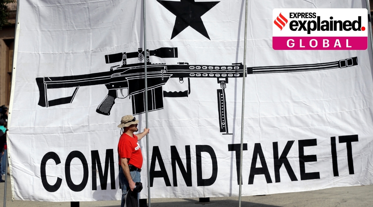 A demonstrator helps hold a large "Come and Take It" banner at a rally in support of open carry gun laws at the Capitol, on Jan. 26, 2015, in Austin, Texas. (AP)