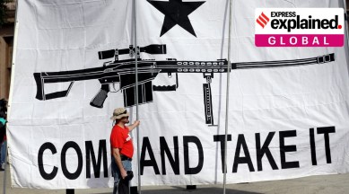 A demonstrator helps hold a large "Come and Take It" banner at a rally in support of open carry gun laws at the Capitol, on Jan. 26, 2015, in Austin, Texas. (AP)