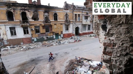 Children walk among buildings destroyed during fighting in Mariupol, in territory under the government of the Donetsk People's Republic, eastern Ukraine. (AP/PTI)
