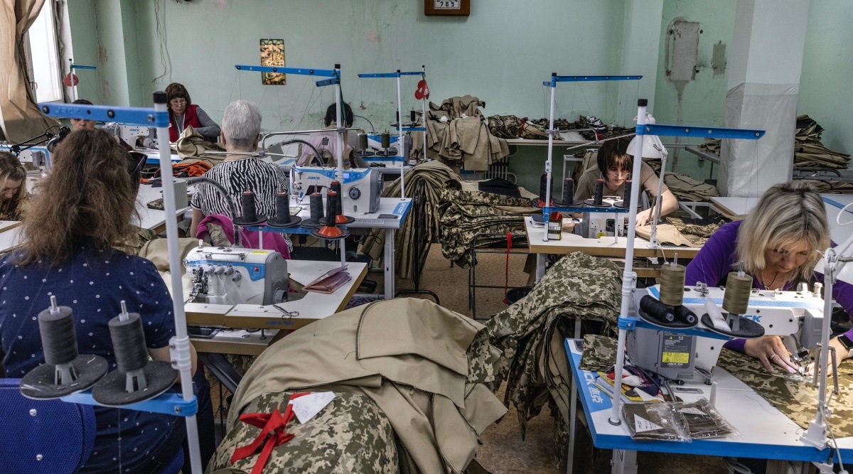 Women sew camouflage uniforms at a garment workshop in Kryvyi Rih, Ukraine, May 4, 2022. (David Guttenfelder/The New York Times)