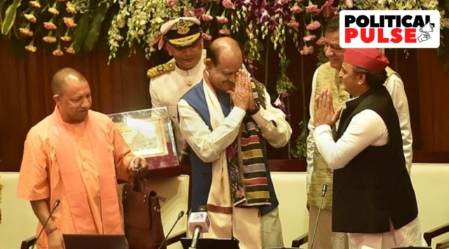 Lok Sabha Speaker Om Birla being greeted by Leader of Opposition Akhilesh Yadav as Uttar Pradesh Chief Minister Yogi Adityanath (L) looks on, during the inauguration of E-Vidhan system to make proceedings paperless, at Vidhan Bhawan in Lucknow, Friday, May 20, 2022.  (PTI)