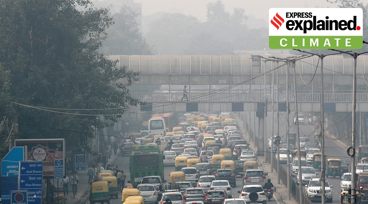 A pedestrian walks on a bridge above vehicle traffic in New Delhi, as the city is enveloped under thick smog. (File)