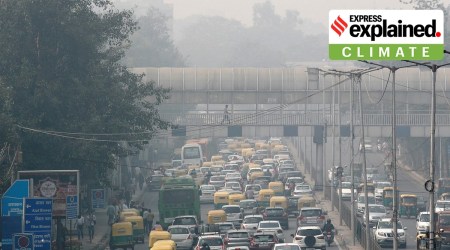 A pedestrian walks on a bridge above vehicle traffic in New Delhi, as the city is enveloped under thick smog. (File)